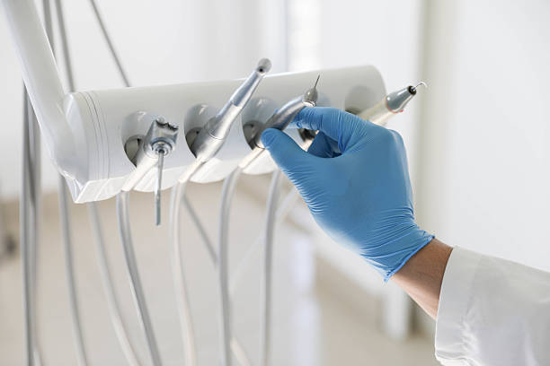 Professional Dental Implants technician working in Roland, OK